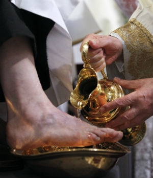Pope Benedict XVI, the Vicar of Christ, washes the feet of Christ's disciples