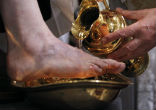 Image of Pope Benedict XVI, the Vicar of Christ, washes the feet of Christ's disciples